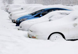 Cars buried in snow